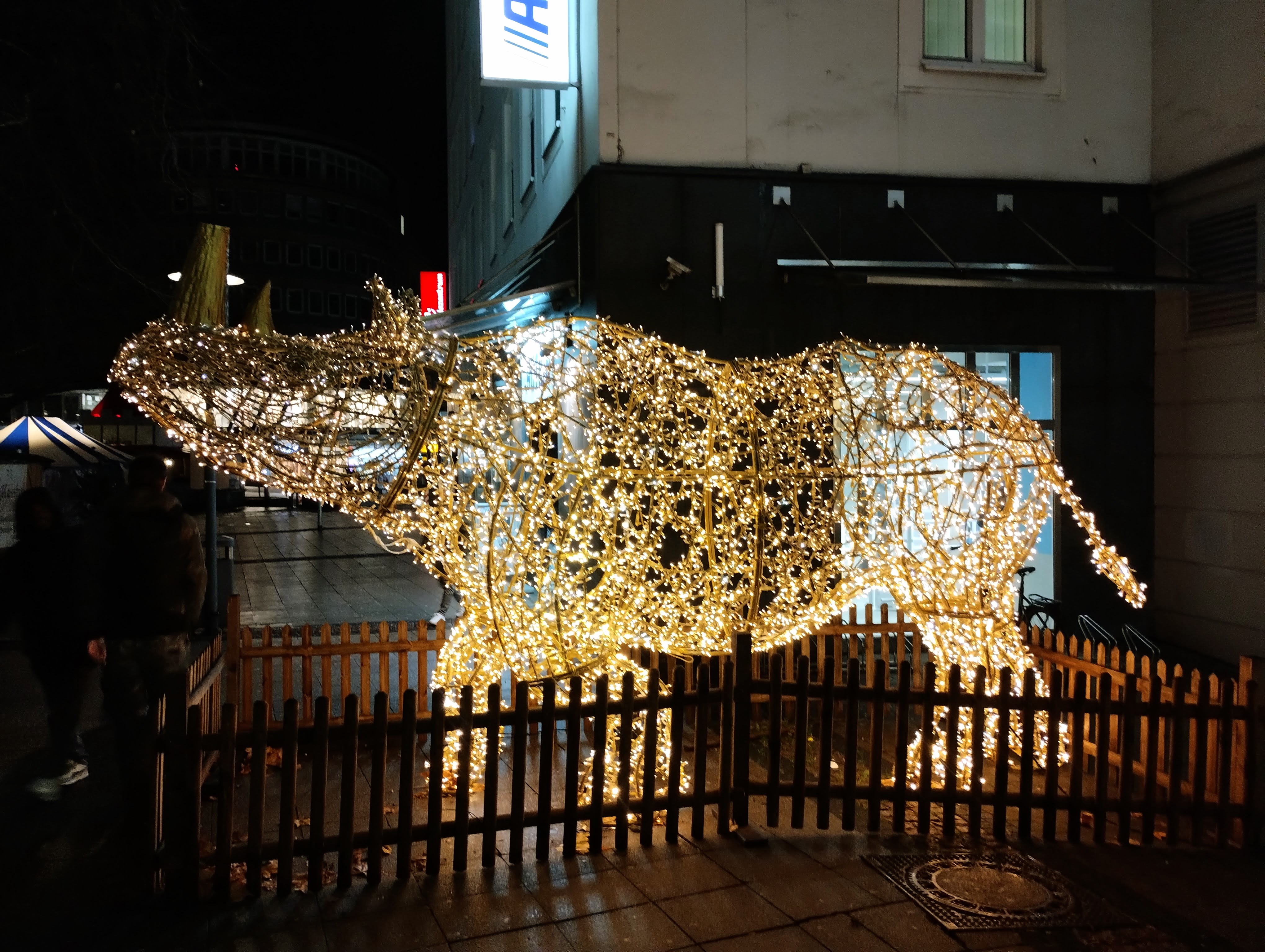 An illuminated rhino is one of the many light animals around the Christmas market.