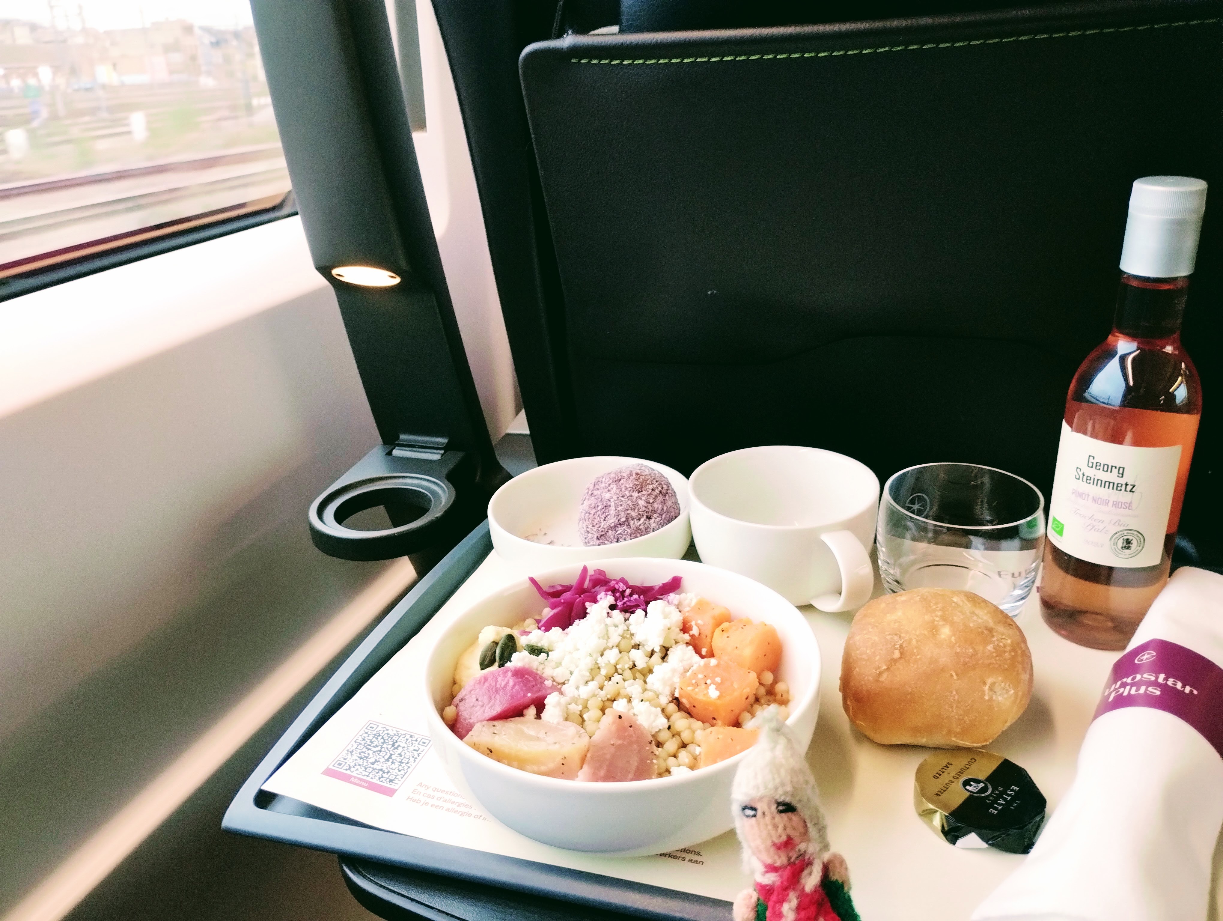 A ravenous puppet prepares to devour a meal on the Eurostar.