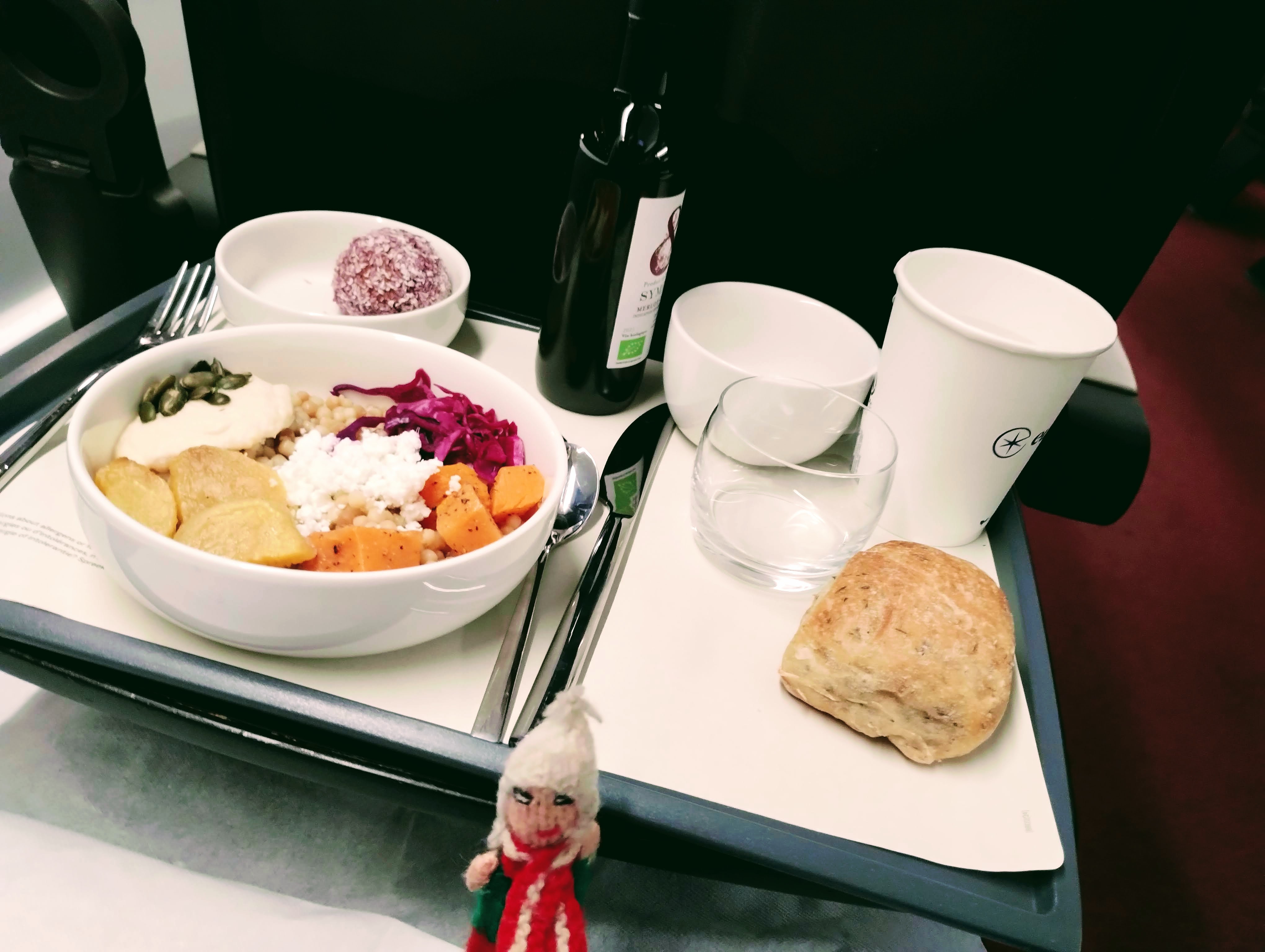 Puppet enjoying a salad and a bottle of red wine on Eurostar.