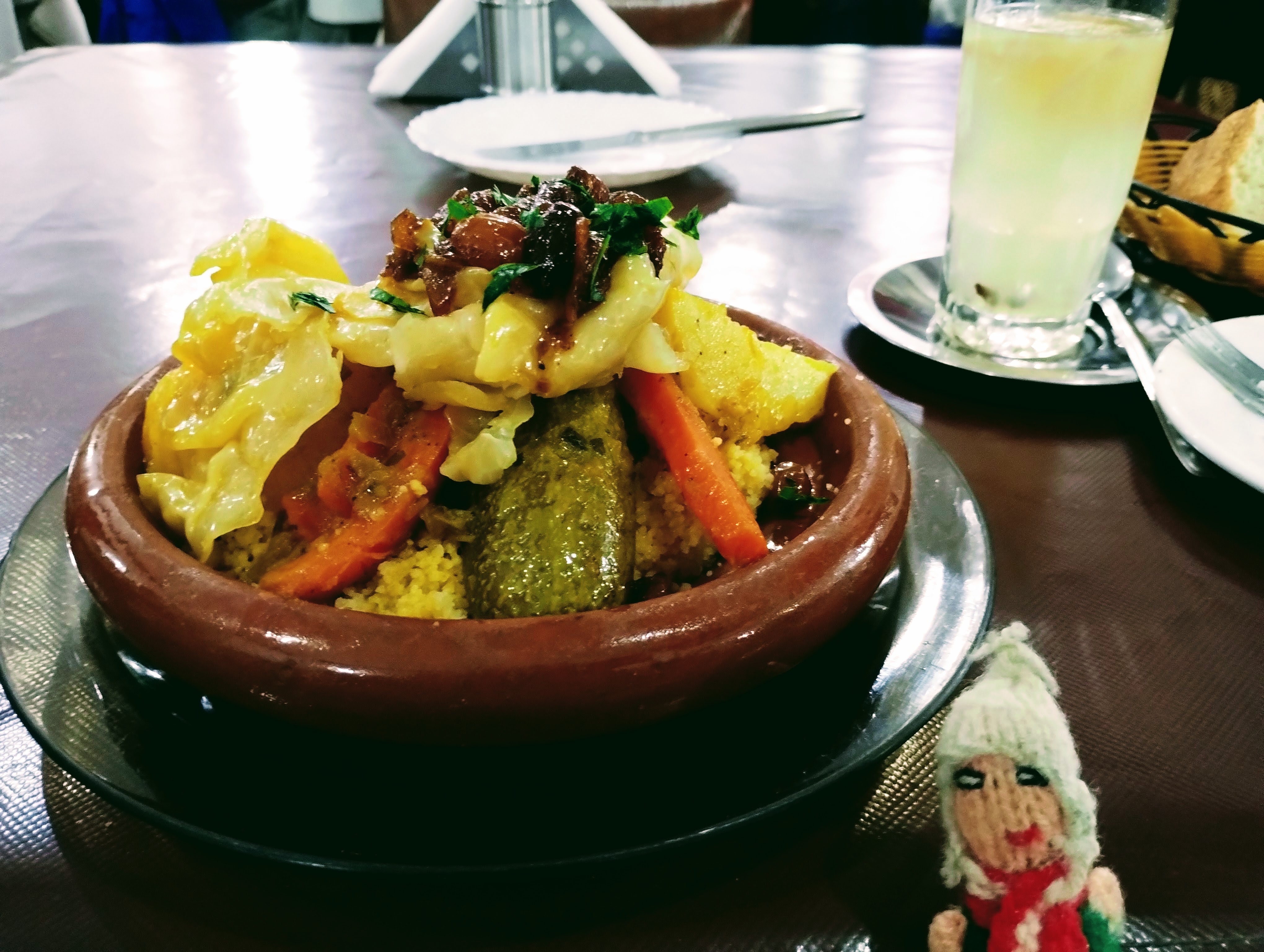 Puppet keen to try a big earthenware bowl of couscous.