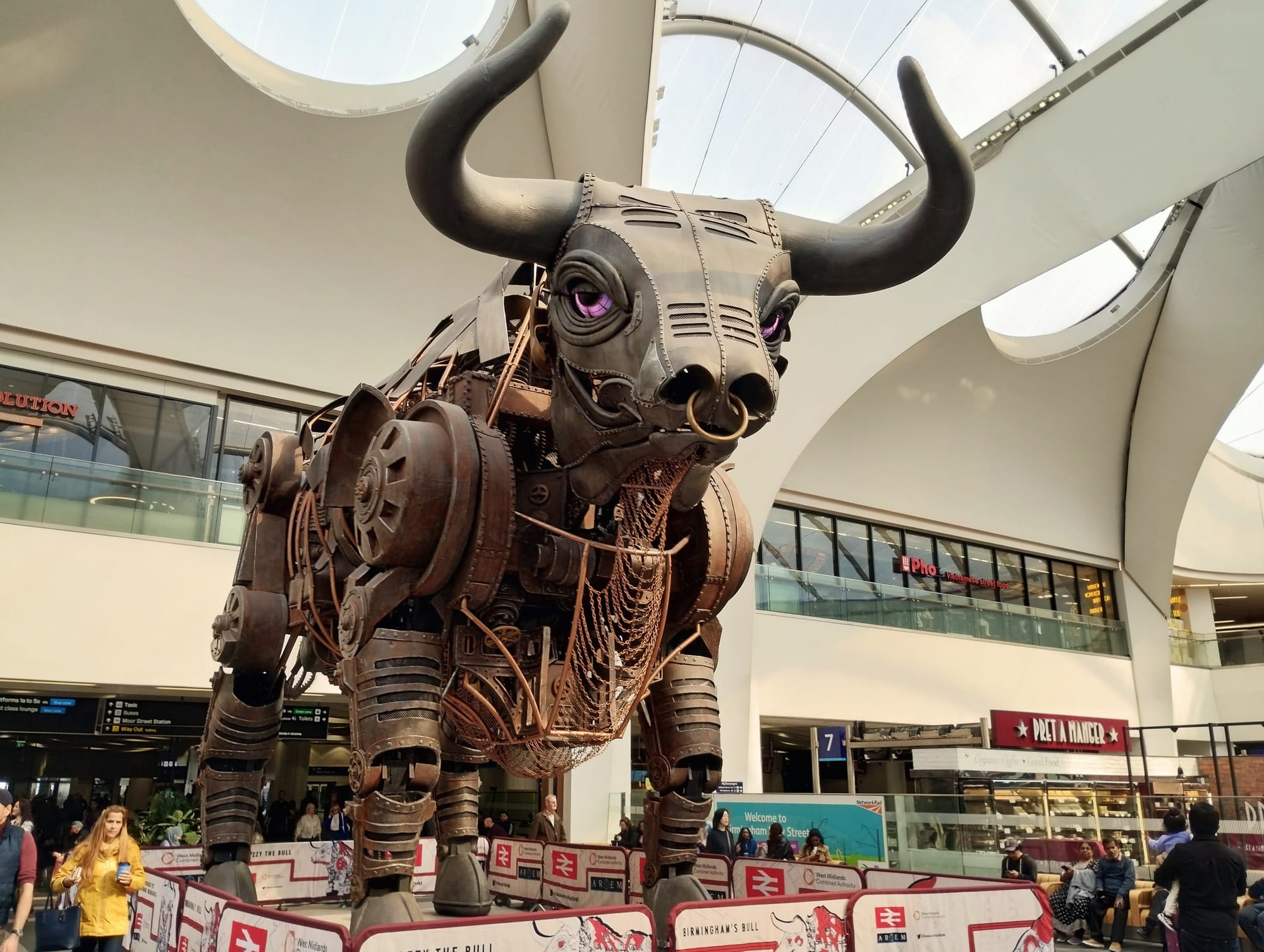 A large mechanical bull in Birmingham New Street station.