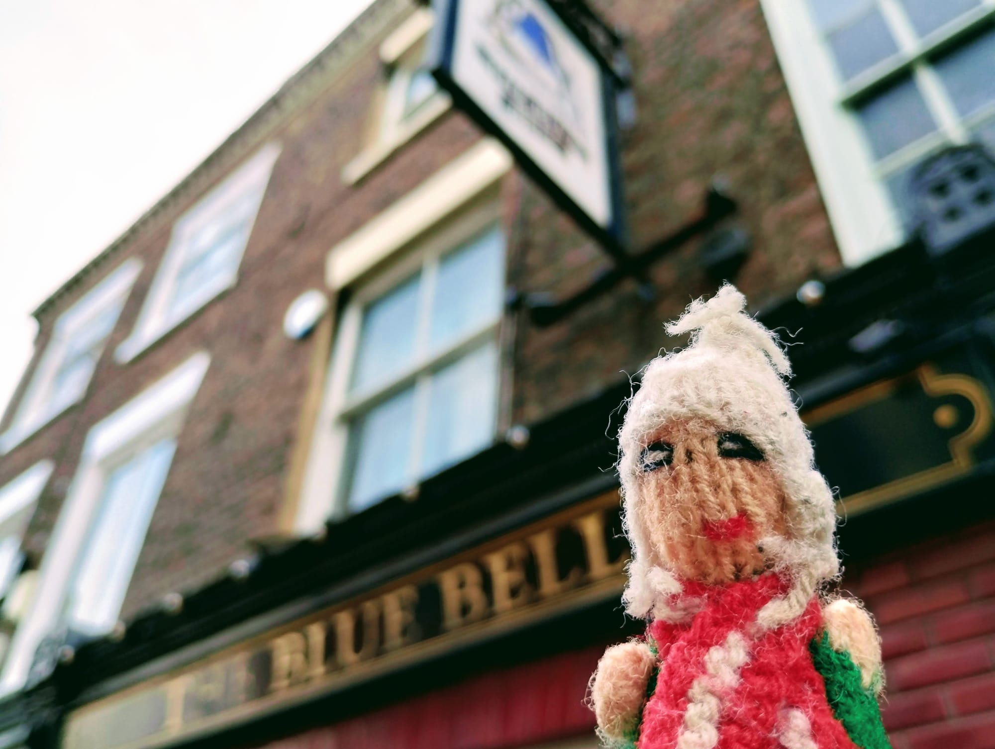 A slightly lairy finger puppet in front of The Blue Bell pub in York.