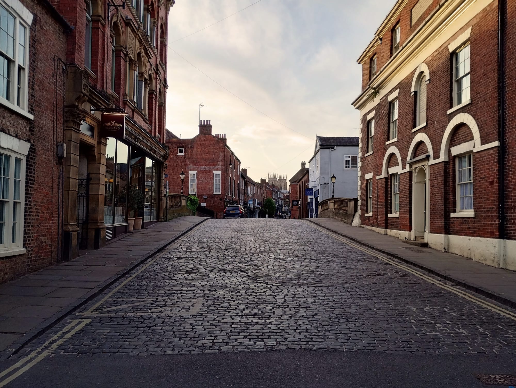A cobbled bridge between two houses in York.