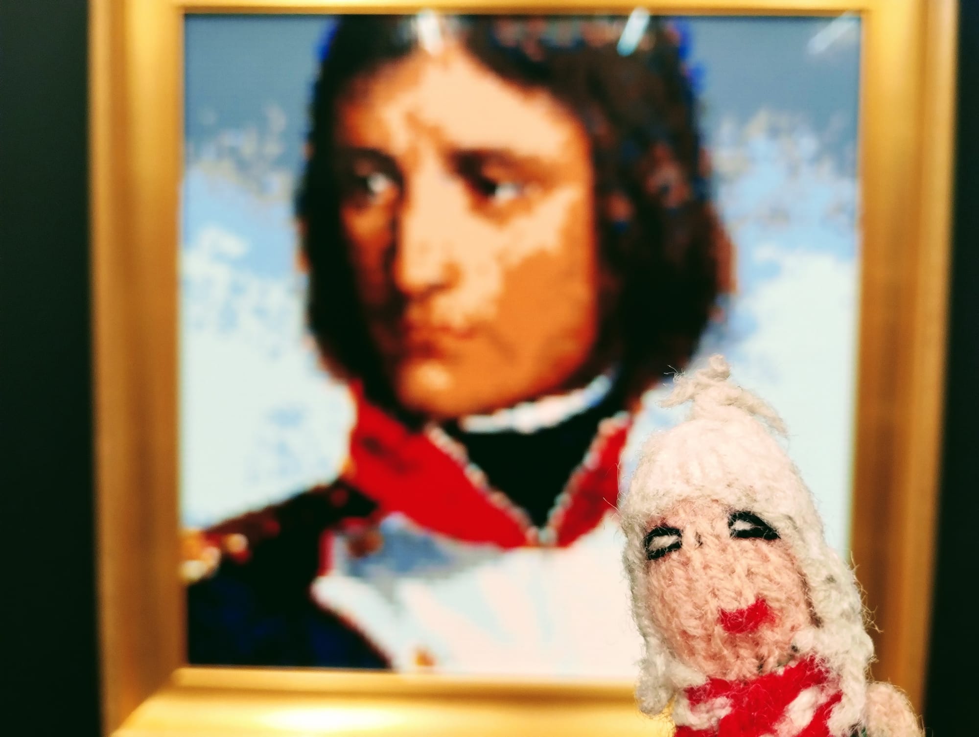 Finger puppet in front of a Lego representation of Henri Félix Emmanuel Philippoteaux's portrait of Bonaparte, aged 23, as lieutenant-colonel of a battalion of Corsican Republican volunteers.