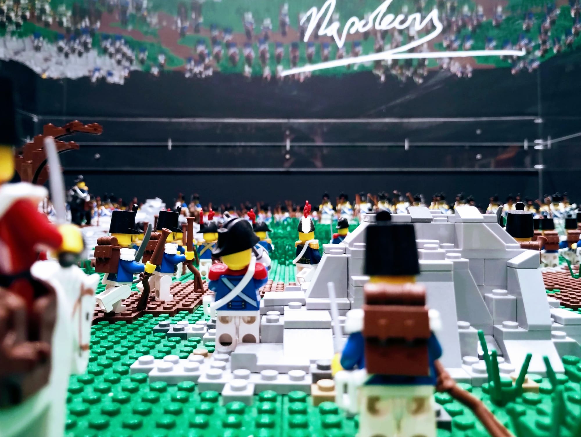 A close-up photograph of a representation of the Battle of Waterloo in Lego. There any many Lego soldiers on horseback.