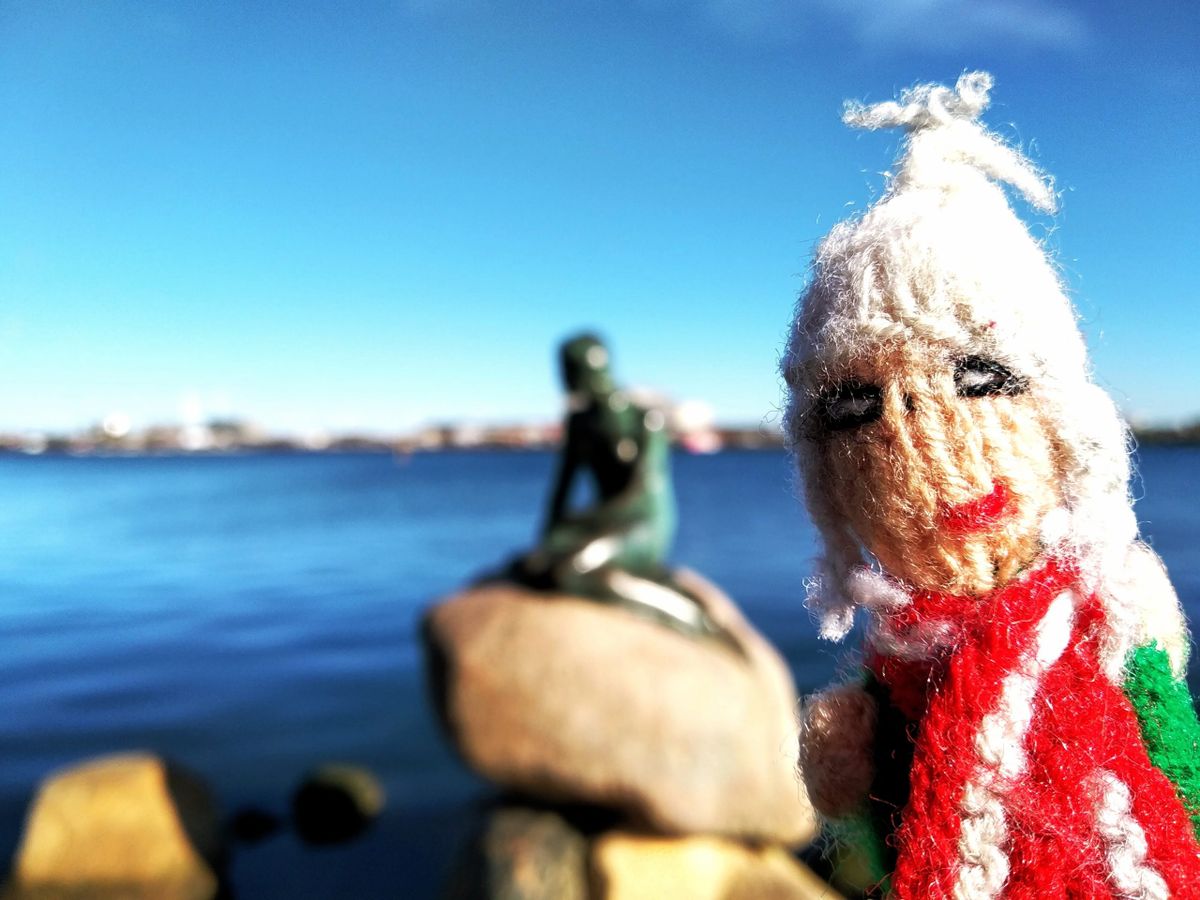 A finger puppet struggles to avert his gaze when confronted with a mermaid becoming human on a rock.