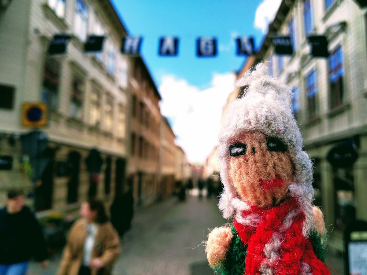 Finger puppet basks in sunshine in Haga, a charming area of traditional wood buildings and cobbled streets in Gothenburg.