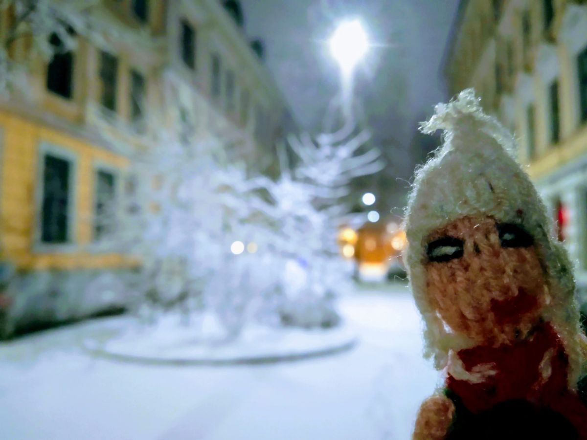 Finger puppet enjoying the snow in late-night Oslo.