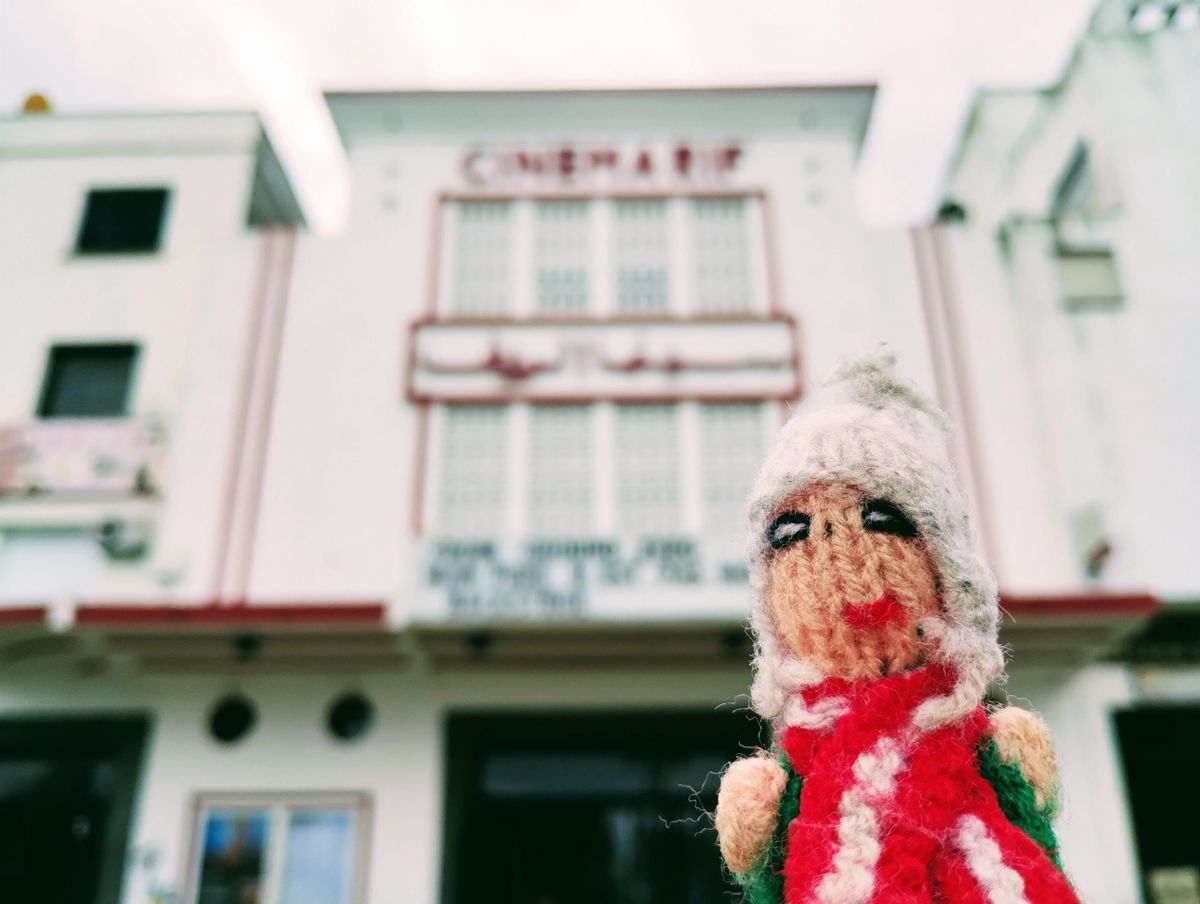 Finger puppet in front of the Cinema Rif in Tangier.