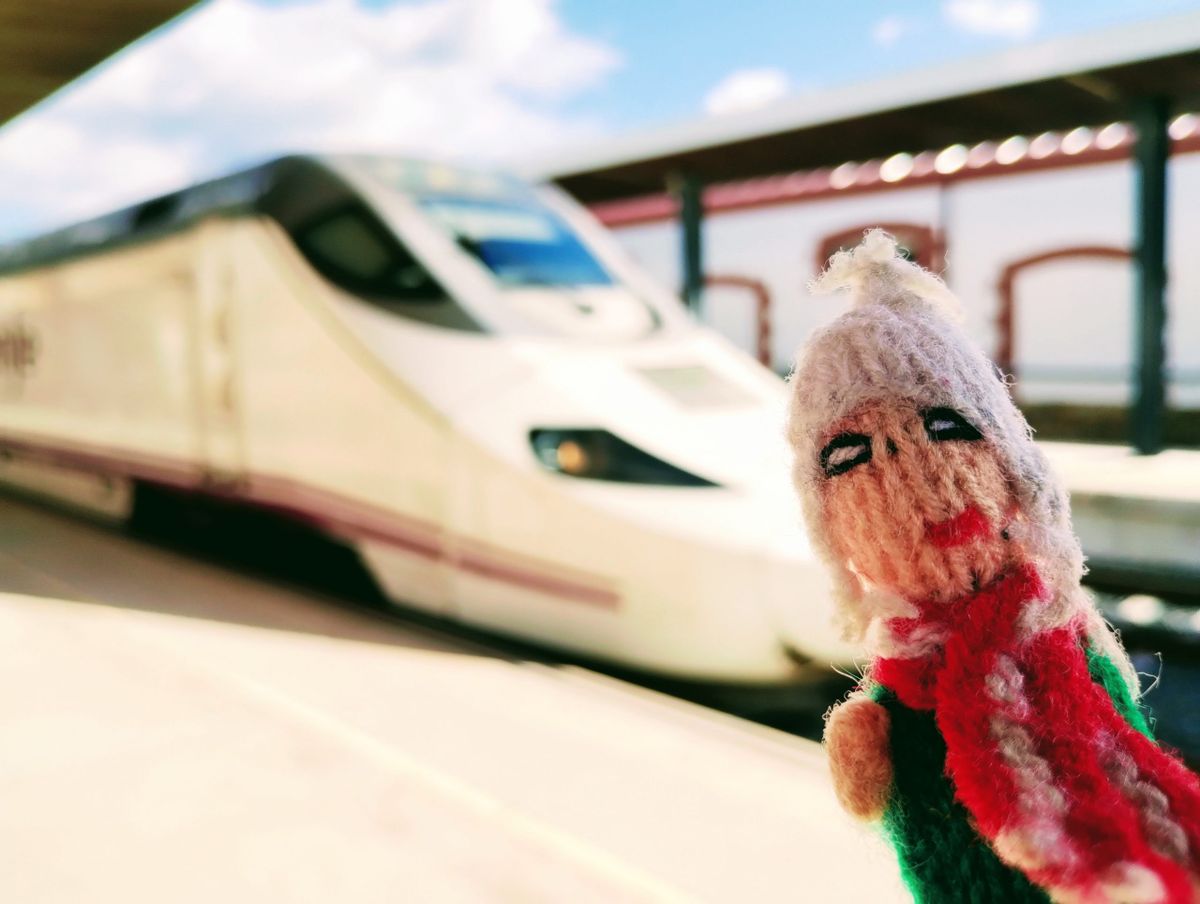 A cheeky Peruvian finger puppet quivers with excitement at the pointy end of a Spanish high-speed train.
