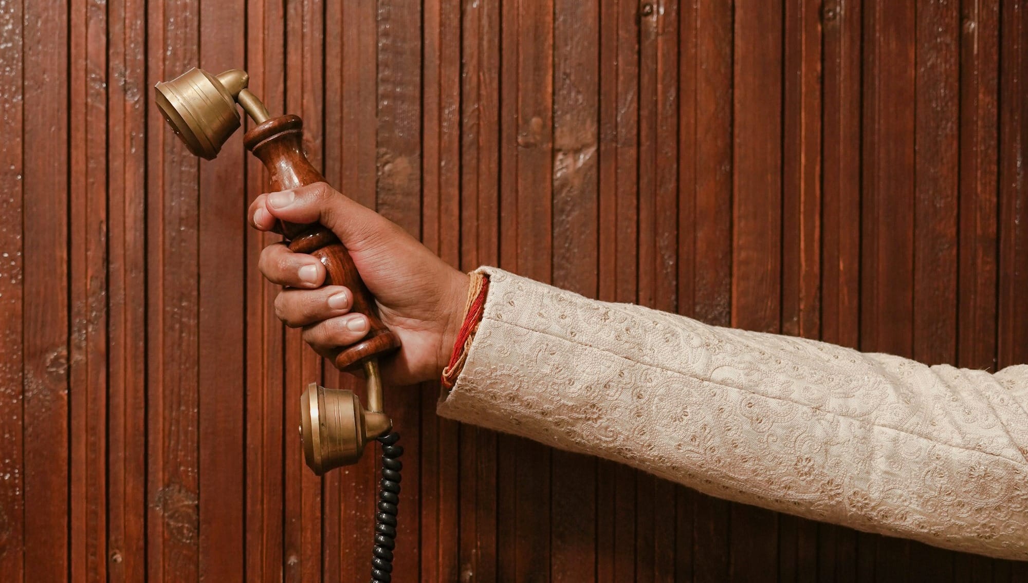 a person is holding a phone in their hand