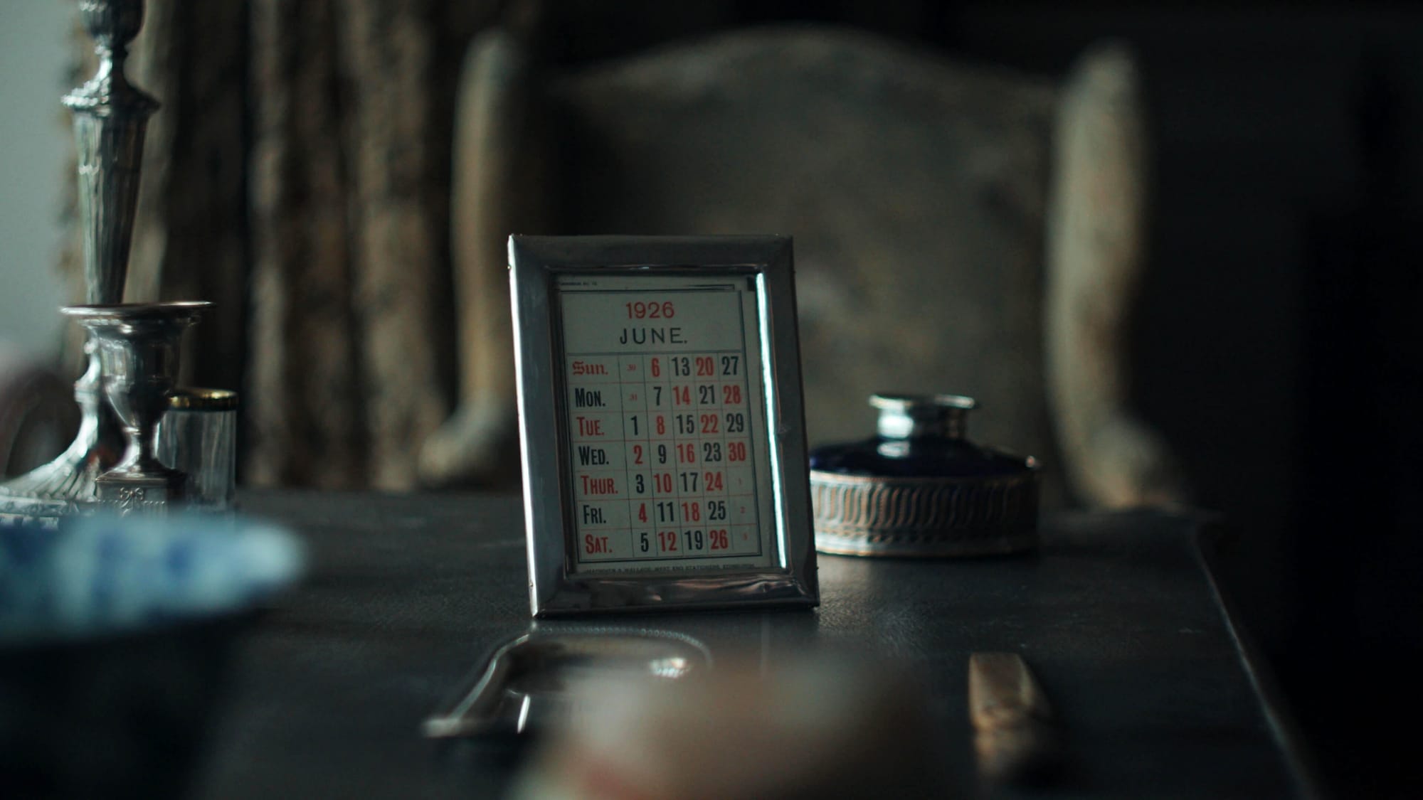 A 1926 calendar sits on the desk