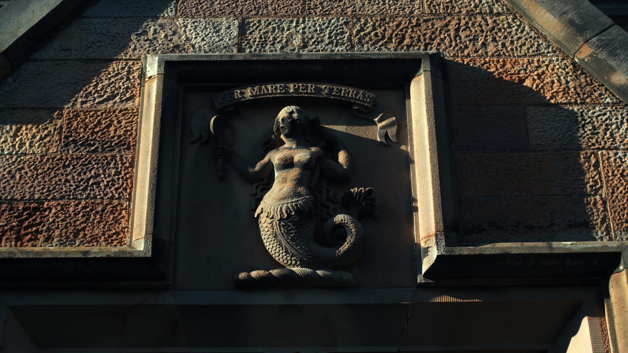 Stone mermaid carving at Lauriston Castle entrance