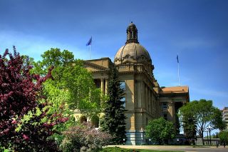 The Alberta Legislature Building in Edmonton on a clear day.