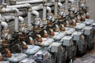 A residential furnace and utility equipment in a home basement during winter.