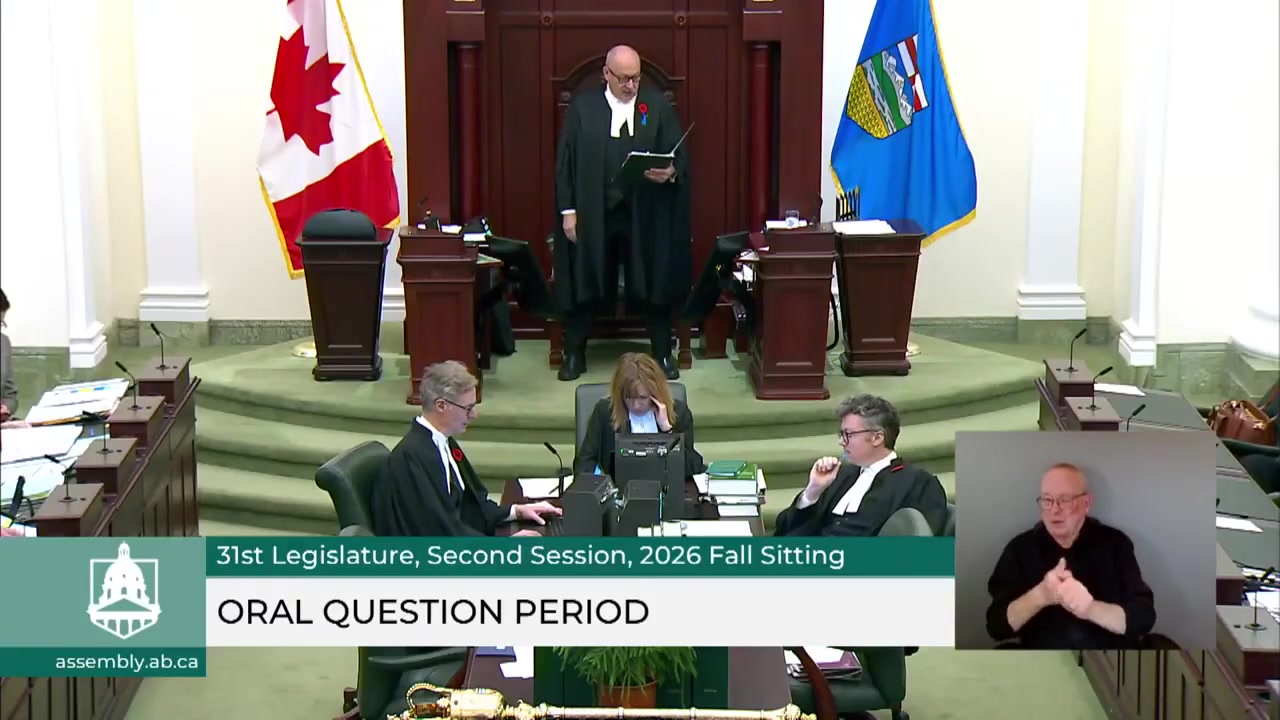 A robed Speaker stands at the raised dais of the Alberta Legislative Assembly chamber during oral question period, Oct. 29, 2026.