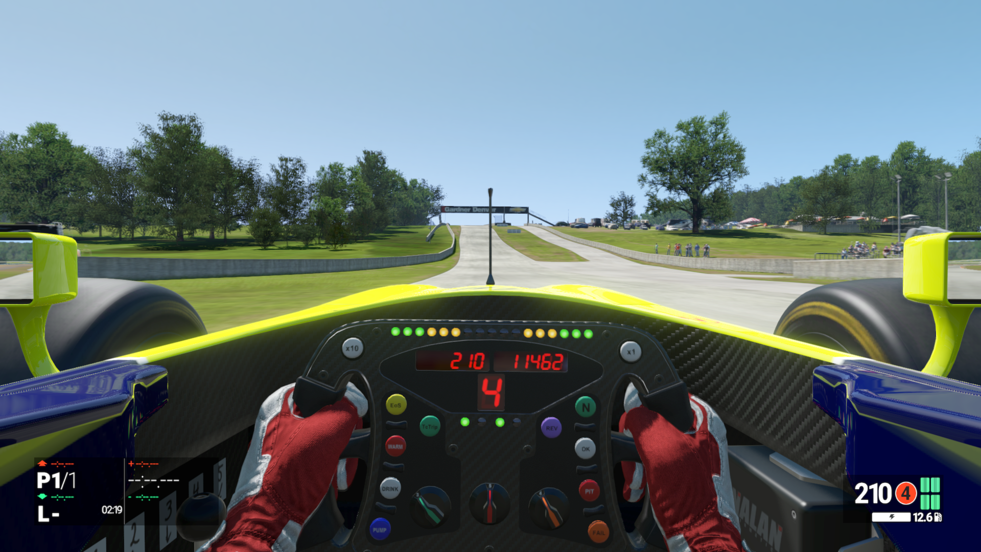 A open wheel race car before the addition of the Halo roll hoop goes up the hill at Road America, from the perspective of behind the wheel in Project CARS 1.