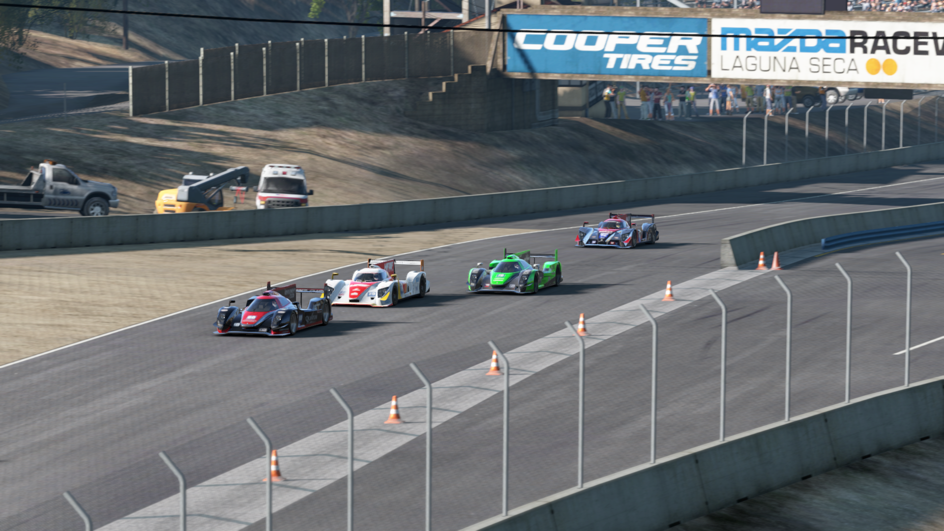 A quartet of Le Mans Prototypes crest the top of the hill at Mazda Raceway Laguna Seca in close proximity to each other, in Project CARS 1.