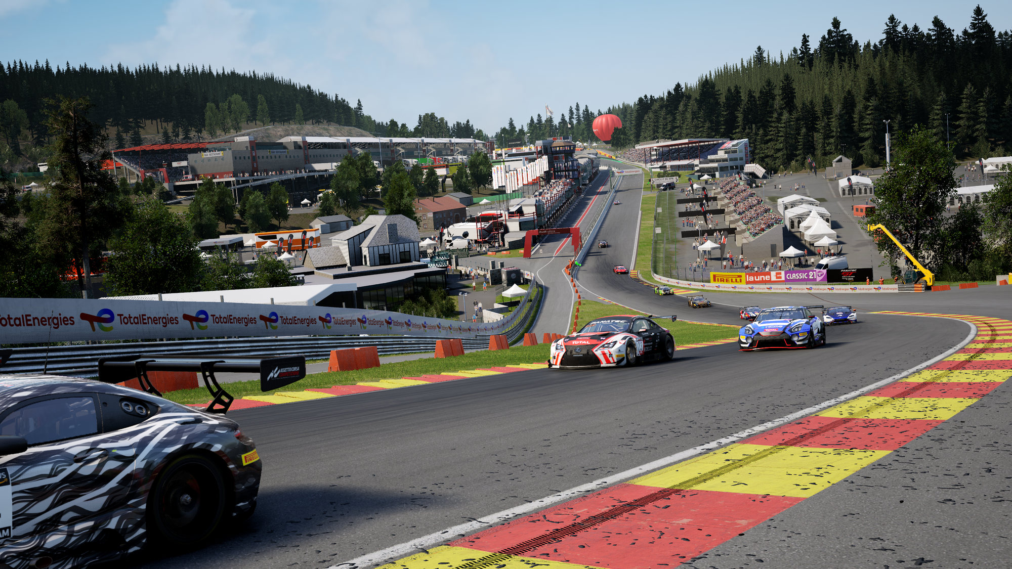 The back half of a field of GT3 cars rise up Eau Rouge and Radillon at Circuit de Spa-Francorchamps. This is a screenshot from Assetto Corsa Competizione.