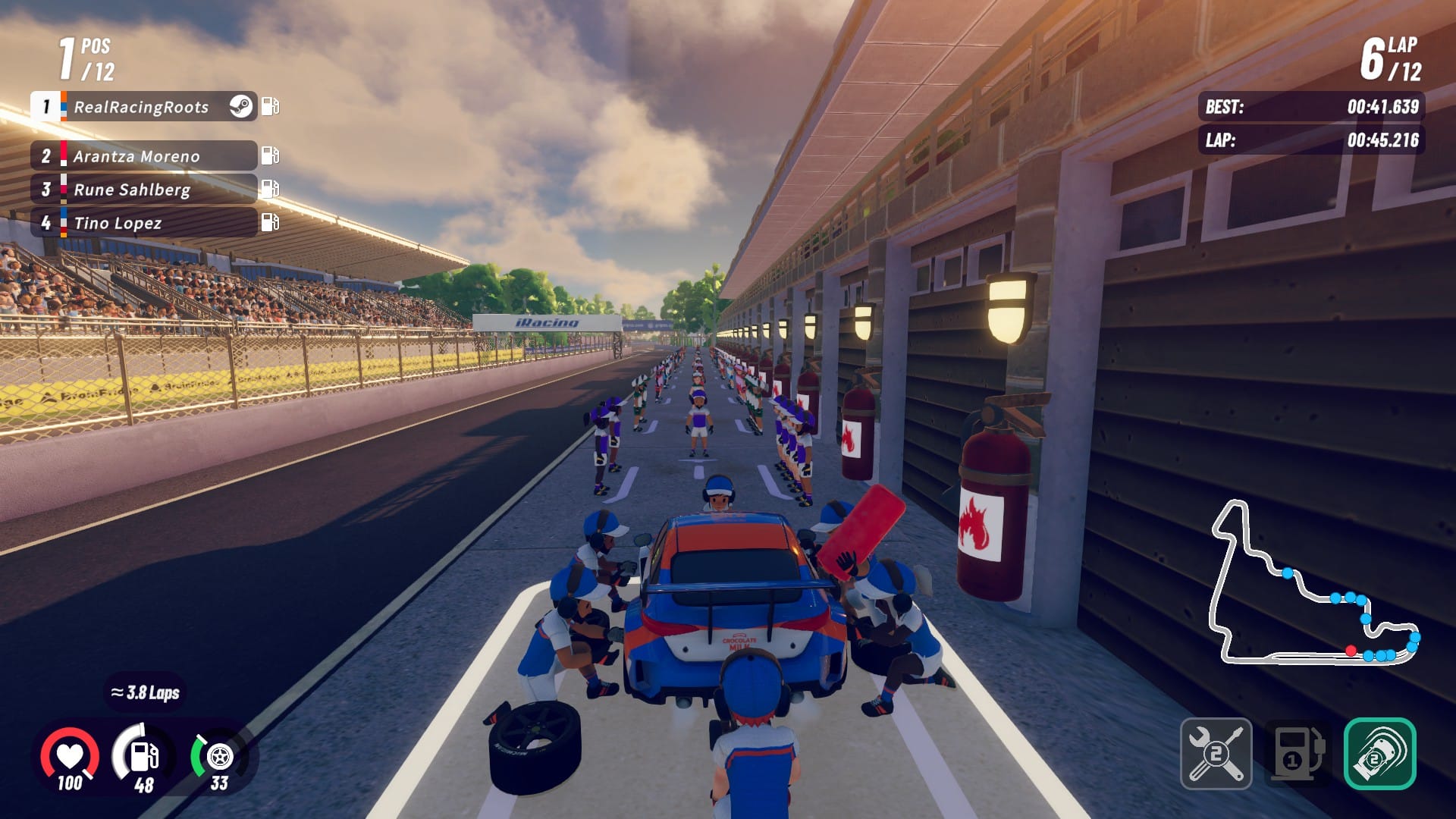 In the middle of a pit stop during a race in iRacing Arcade. The touring car is getting a full service from the pit crew.