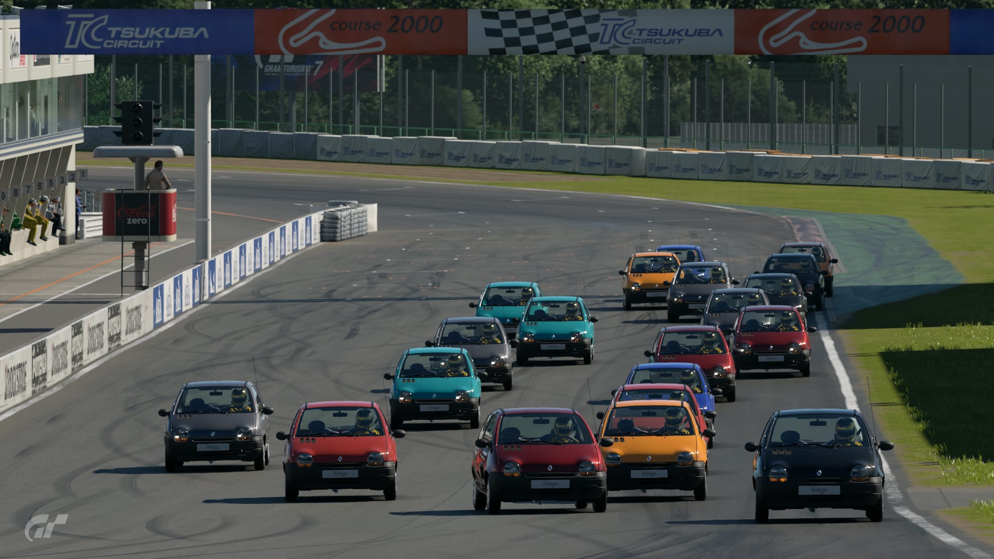 Twenty Renault Twingos leave the grid at the start of a race at Tsukuba Circuit.
