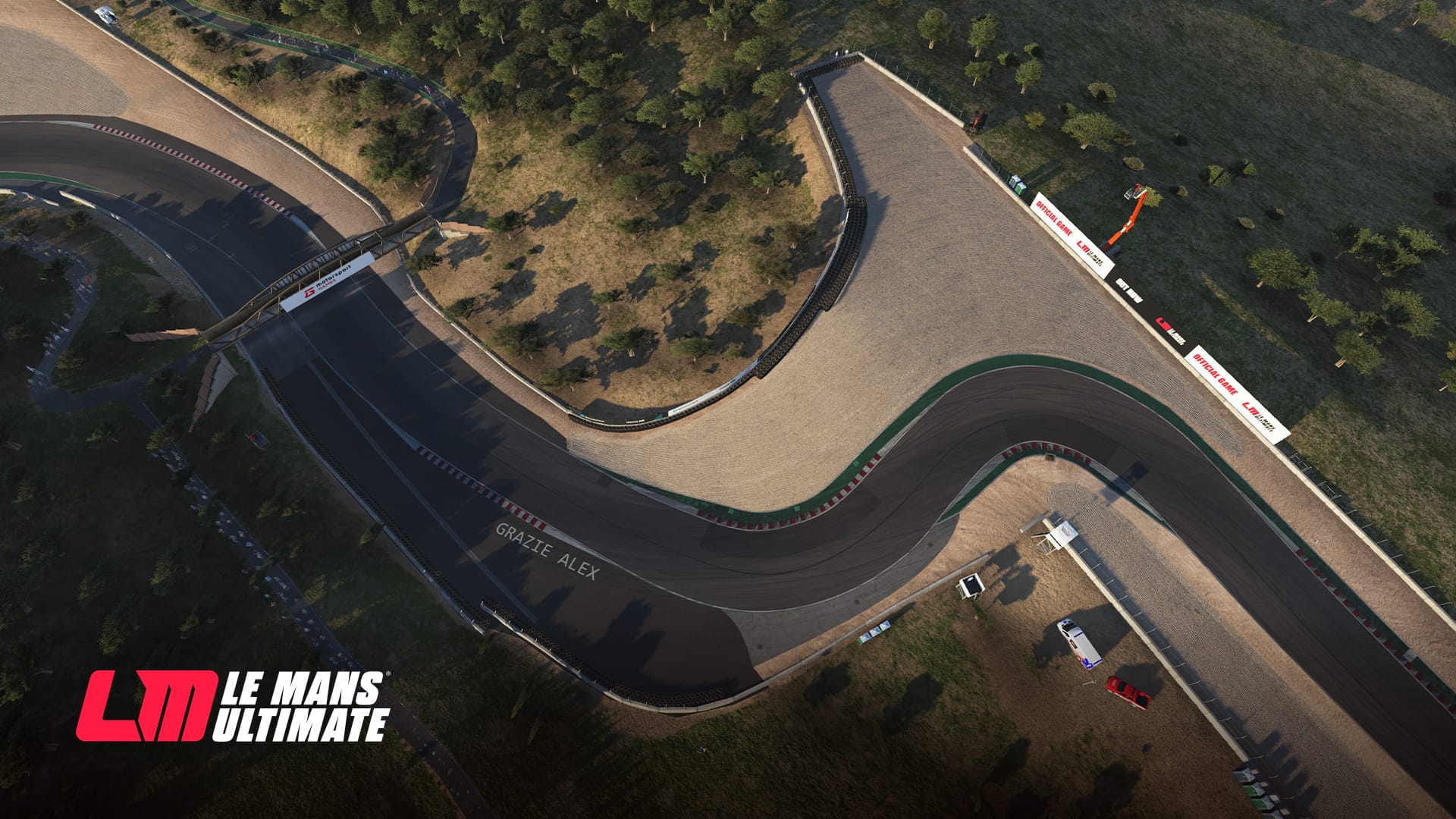 A view of The Corkscrew corner section at Weathertech Raceway Laguna Seca from a helicopter. The Grazie Alex tribute text is visible on the left side of the exit of the corner.