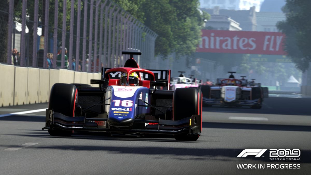 A pack of Formula 2 cars thunder down the straightaway past turn 2 at the Baku City Circuit in F1 2019.