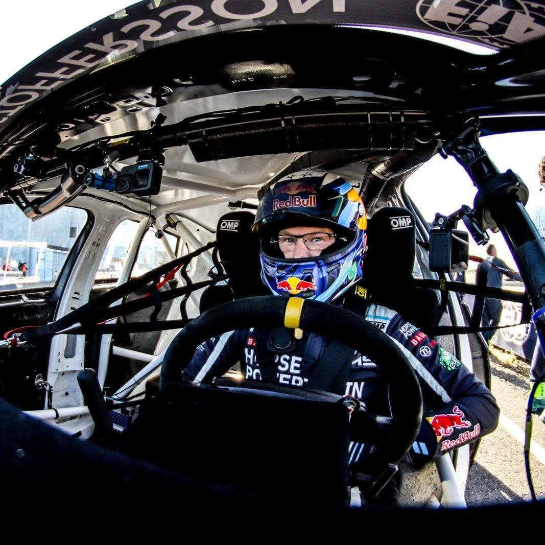 Johan Kristoffersson sitting in the cockpit of his VW Polo rallycross car before the start of a race.