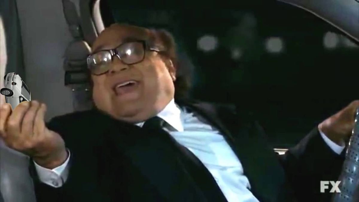 Danny Devito offering you a white Renault Twingo while driving behind the wheel, from It's Always Sunny in Philadelphia