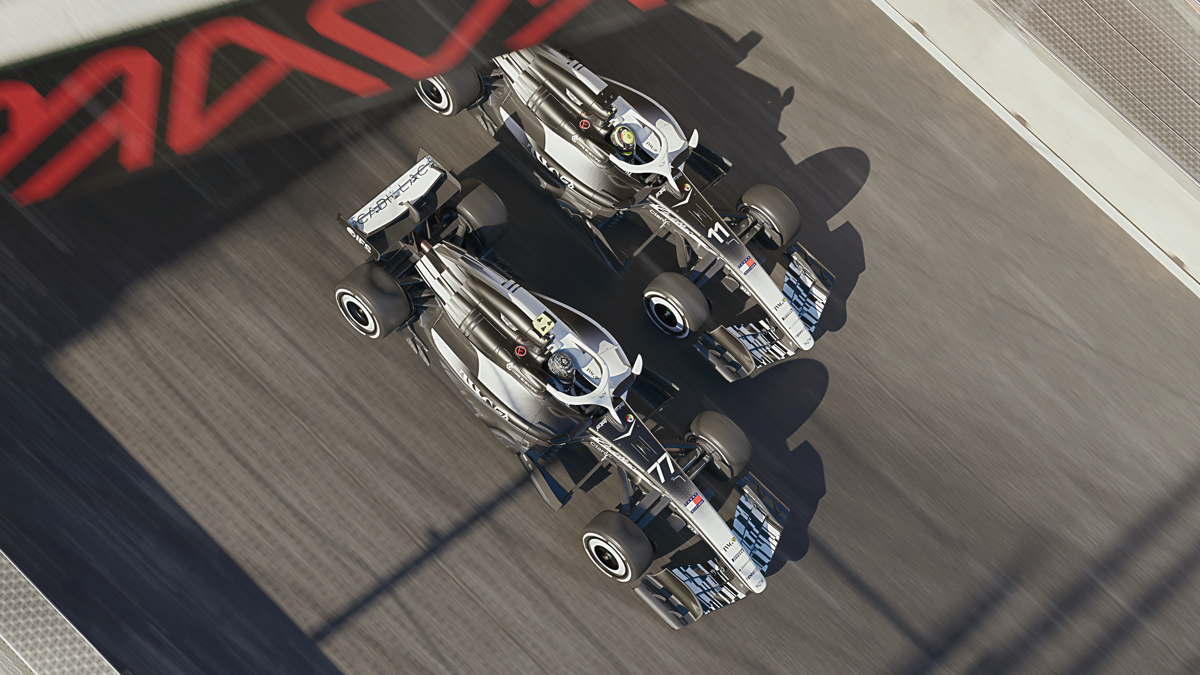 The pair of Cadillac Formula 1 cars going side by side at the Madring.