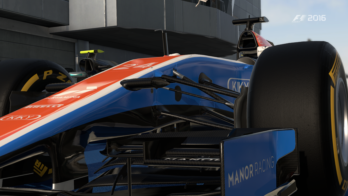 The blue, with red and white Manor MRT05 Formula 1 car in the parc ferme area after a race.