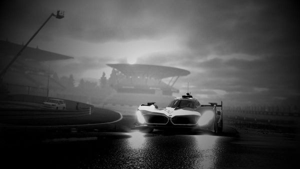 A black and white photo of the BMW M Hybrid V8 at the first corner of the Nurburgring GP-Strecke in Project Motor Racing.