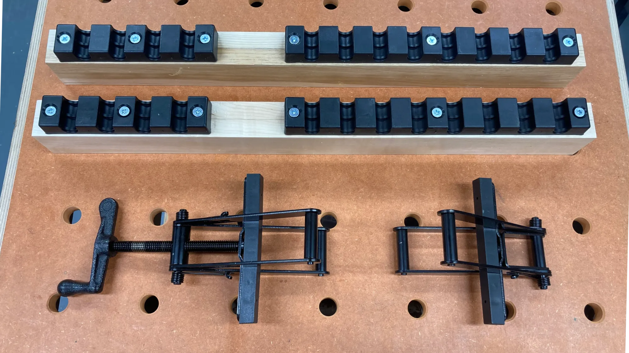 Image showing the parts of a 4-way Equipressure clamp.