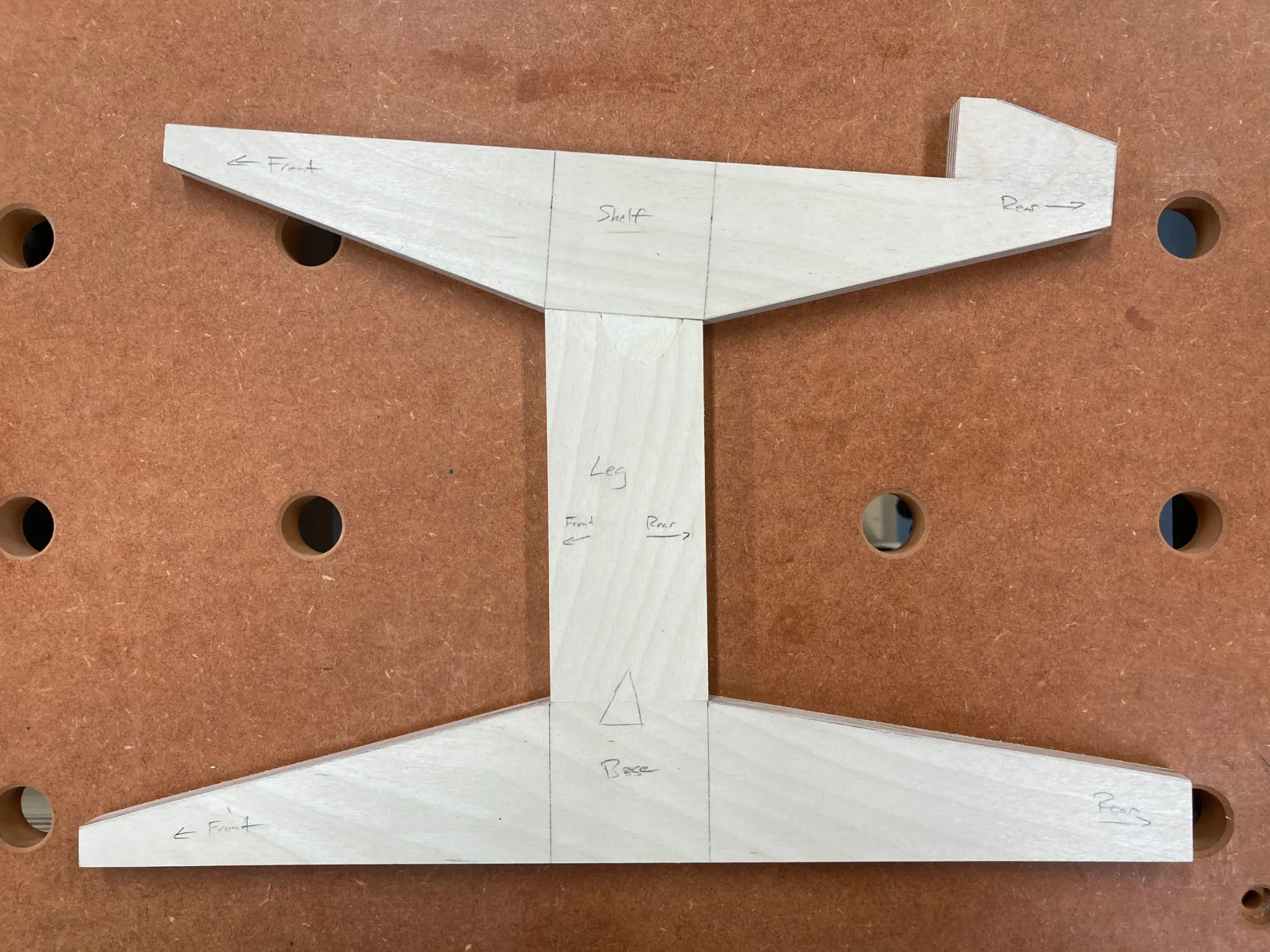 An image showing plywood templates for the speaker support, leg and base parts of the leg assembly.