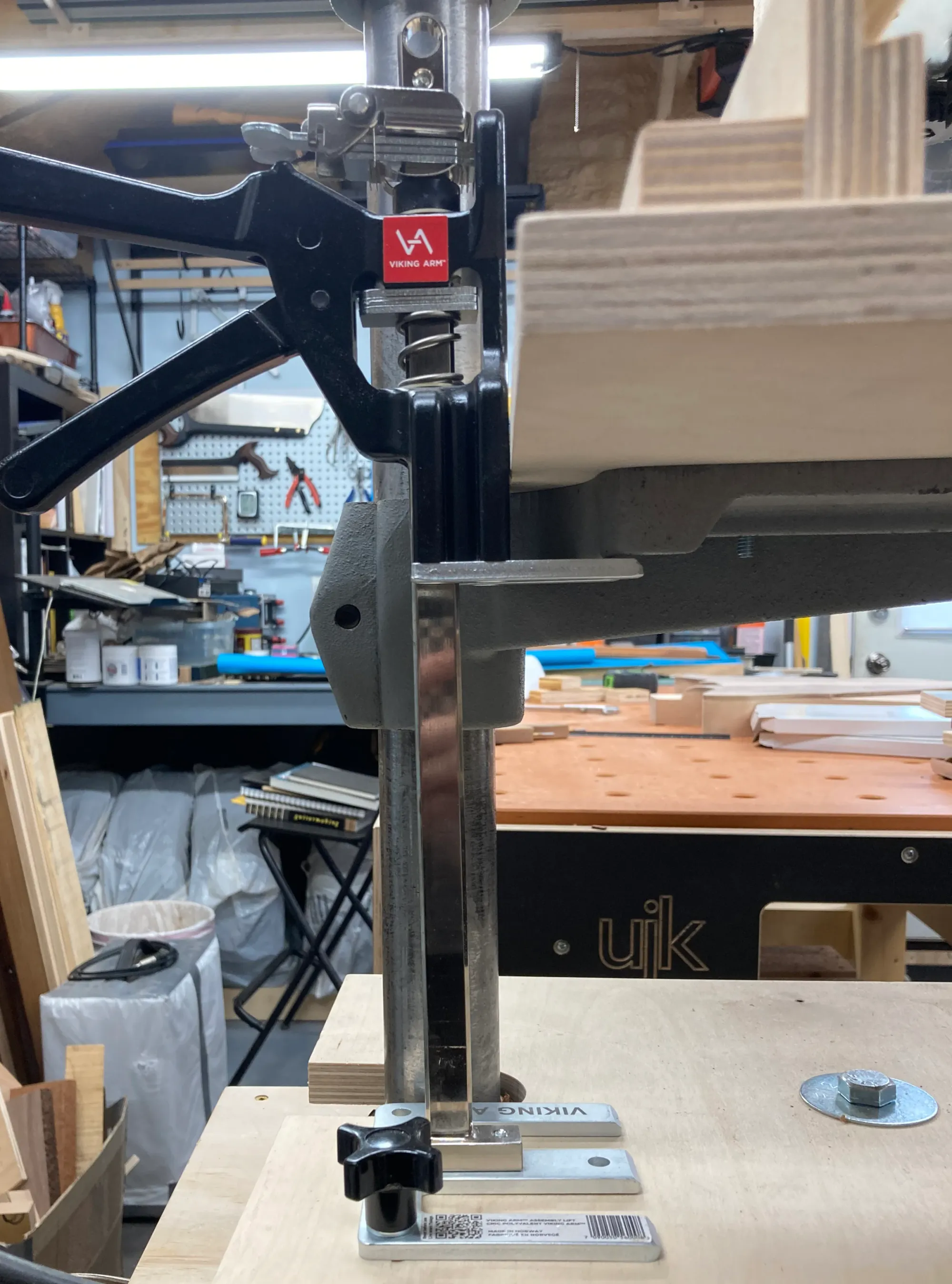A Viking Arm cabinet installation jack being used as a height adjustment mechanism for a drill press.