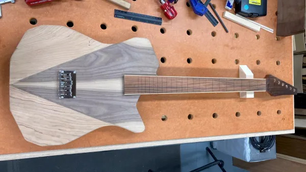 A photo of a partially assembled prototype electric guitar.