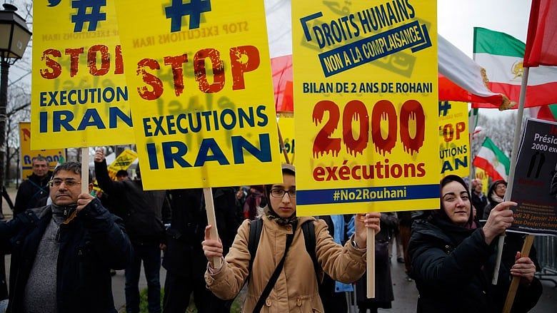As Europe signs deals with Iran, protestors decry reception for ‘Executioner of Freedom’