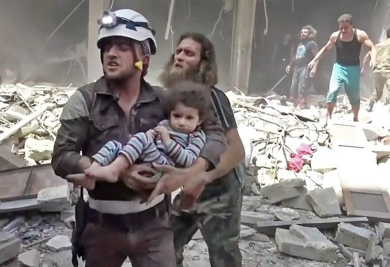 Airstrikes, shelling kill at least 60 in Syria’s Aleppo