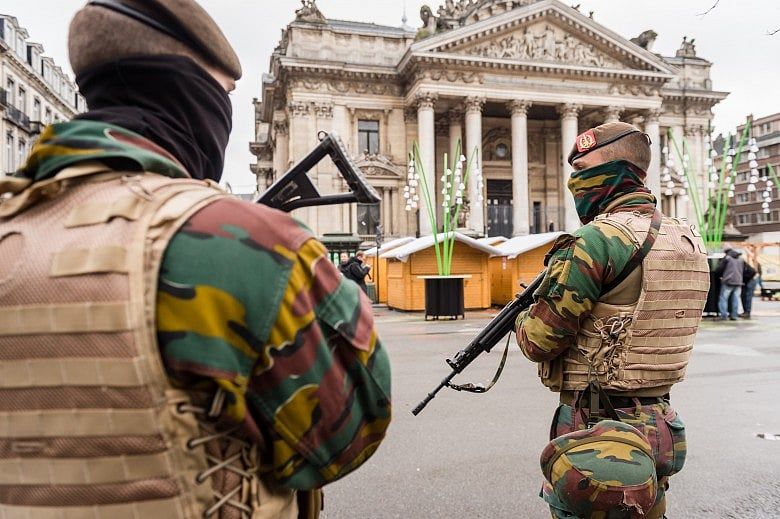 Belgium police arrest 16, Paris fugitive still at large