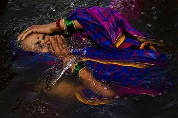 India’s river waters cleanse spirits at Hindu festival