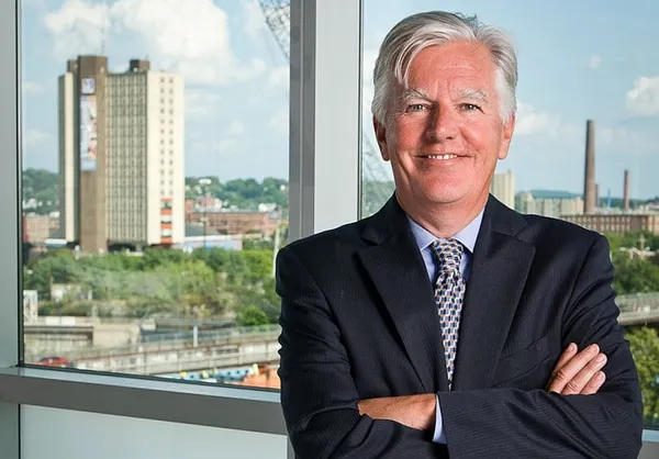 On heels of tuition hike, Meehan agrees to pay faculty pay raises