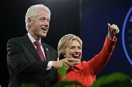 Clintons rake in millions from Wall Street