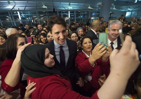 Syrian refugees land in Canada by the planeload