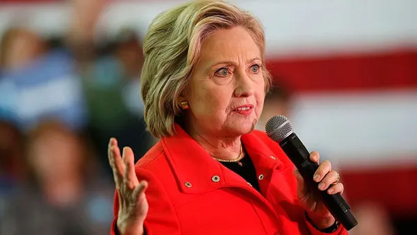 Superdelegates help Clinton expand her lead despite NH loss