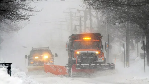 New England mops up as snow falls on East Coast