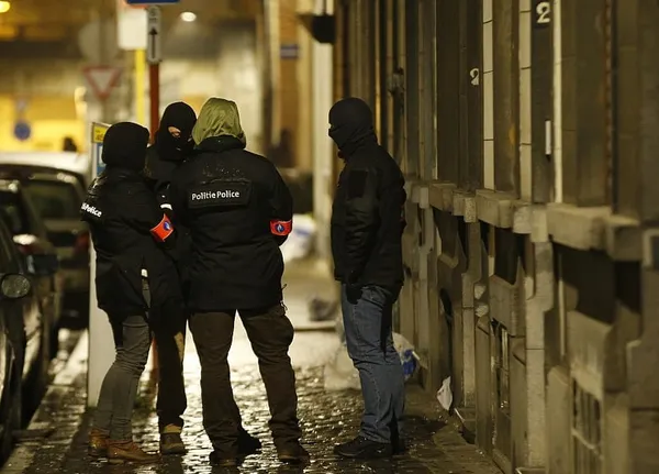 Brussels police conduct more raids linked to deadly bombings