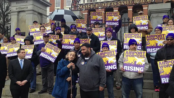 Logan workers call off strike, rally for $15 an hour