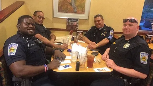 Couple refuses to sit next to cops; officers respond with heartwarming gesture