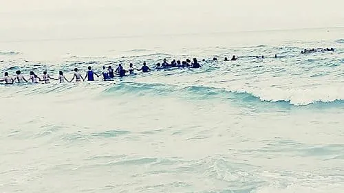 Human Chain Beach Heroes Helped Save A Family; Maybe They Can Help Save A Nation