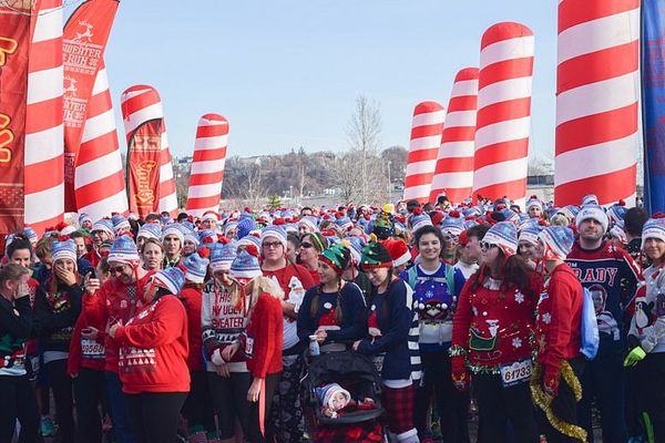 Fashion faux pas bring joy as runners don ugly sweaters for charity